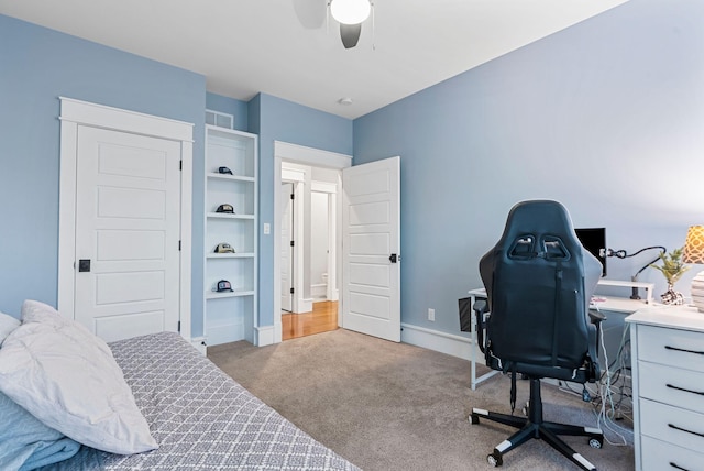 bedroom with light colored carpet and ceiling fan