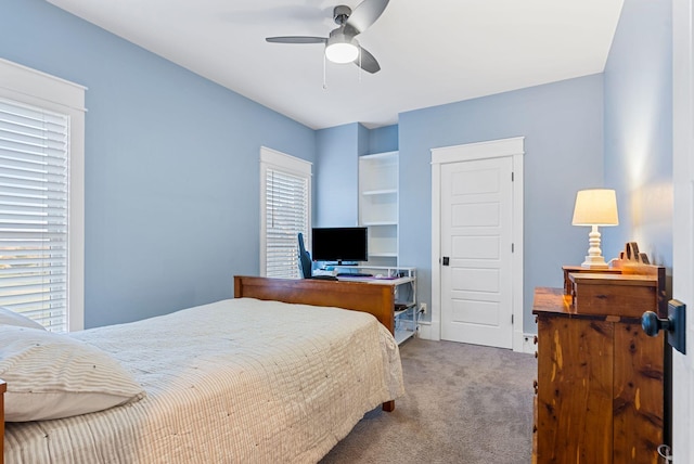 bedroom with ceiling fan and carpet flooring