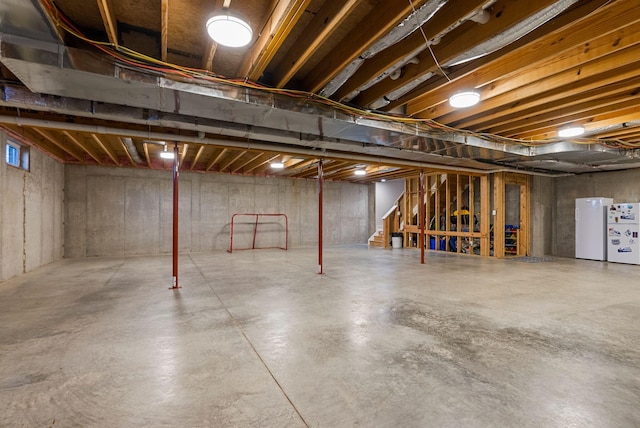 basement featuring white refrigerator