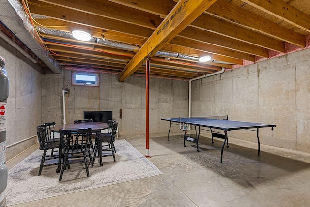 rec room with concrete floors