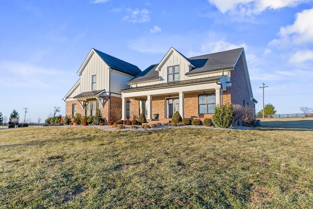 view of front facade with a front lawn and a porch