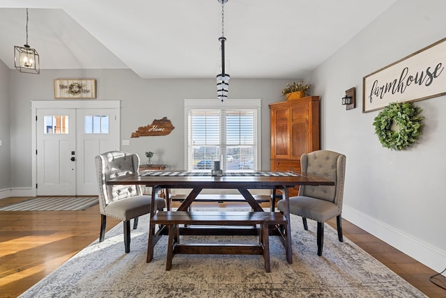 dining space with dark hardwood / wood-style floors