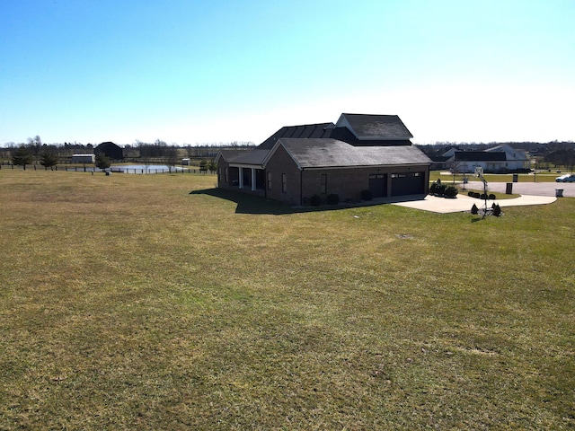 view of yard featuring a garage