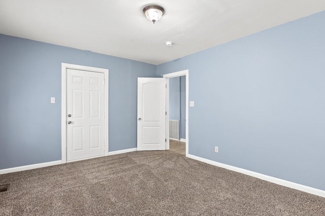 unfurnished bedroom with carpet flooring