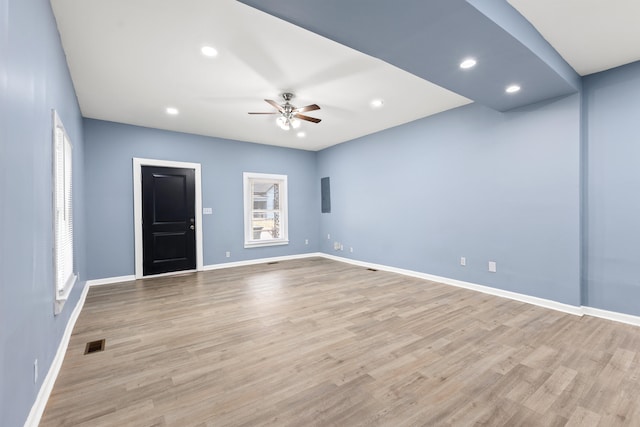 unfurnished room featuring ceiling fan and light hardwood / wood-style floors