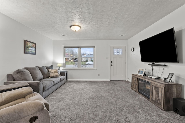 living room with carpet flooring and a textured ceiling