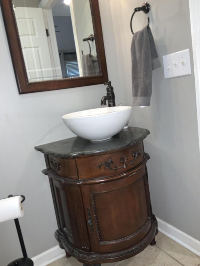 bathroom with tile patterned floors, toilet, and vanity