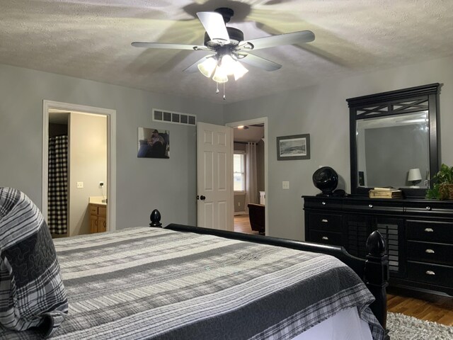 bedroom featuring wood-type flooring and ceiling fan