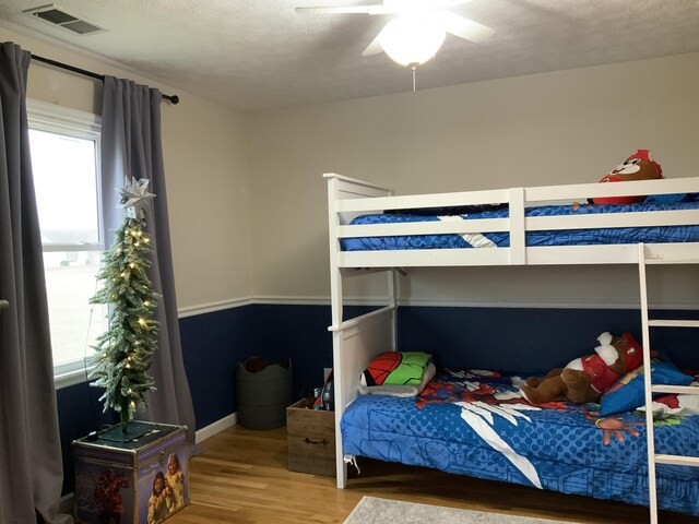 bedroom with hardwood / wood-style floors