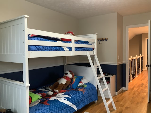 bedroom with wood finished floors