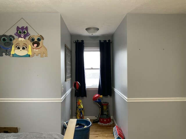 bedroom with hardwood / wood-style flooring