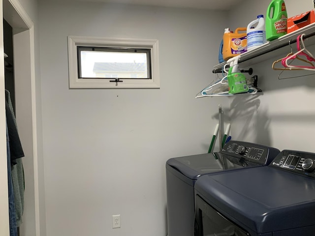 laundry area featuring washer and clothes dryer and laundry area