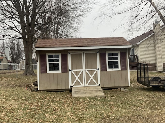 view of outdoor structure with a lawn