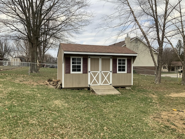 view of shed featuring a fenced backyard