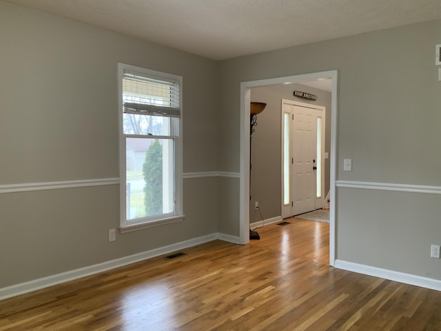 empty room featuring hardwood / wood-style flooring