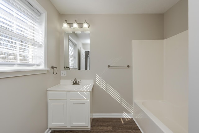 bathroom with vanity and hardwood / wood-style flooring