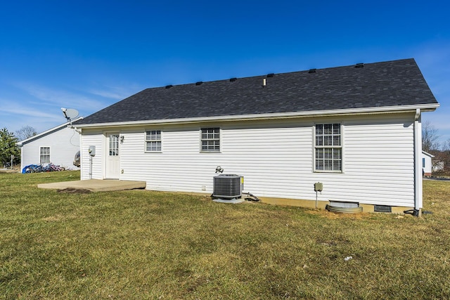 back of house with a lawn, a patio, and central air condition unit