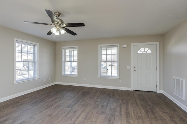 foyer with ceiling fan and dark hardwood / wood-style floors