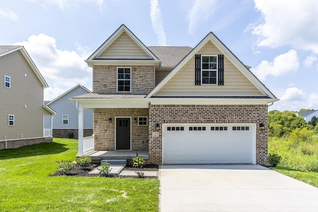 view of front of home featuring a garage and a front yard