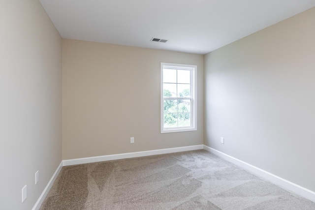 unfurnished room featuring carpet flooring