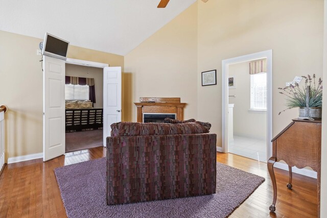 clothes washing area featuring washer and clothes dryer and light hardwood / wood-style flooring