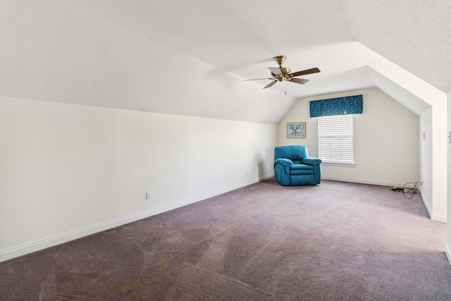 bonus room with lofted ceiling, carpet floors, a textured ceiling, and ceiling fan