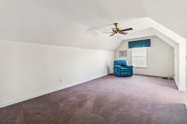 additional living space with vaulted ceiling, ceiling fan, and carpet flooring