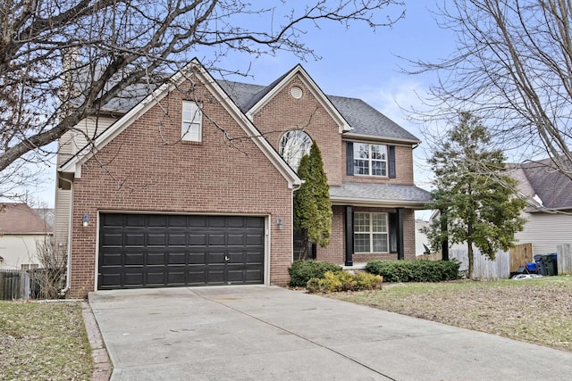 traditional-style home featuring a garage, roof with shingles, concrete driveway, and brick siding