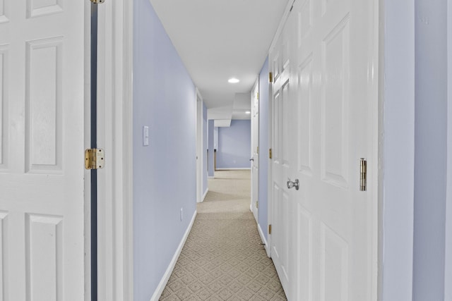 hall featuring baseboards