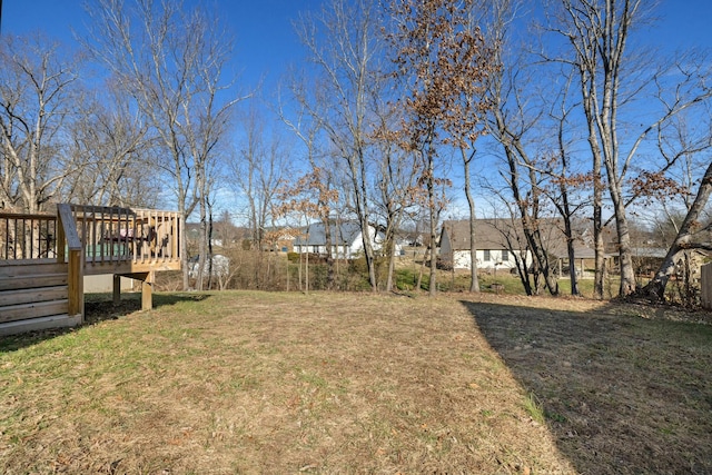 view of yard featuring a wooden deck