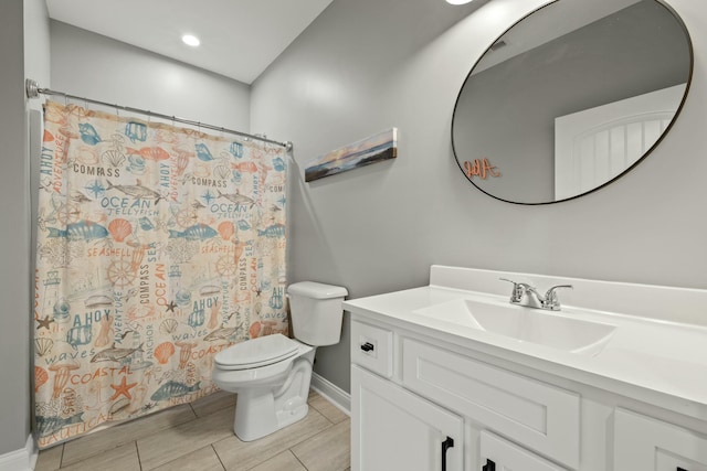 bathroom featuring a shower with curtain, vanity, and toilet