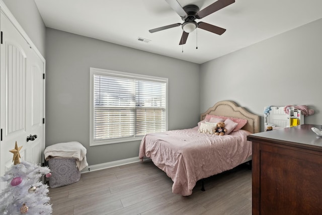 bedroom featuring ceiling fan and light wood-type flooring