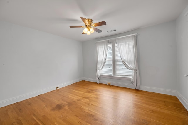 unfurnished room featuring light hardwood / wood-style flooring and ceiling fan