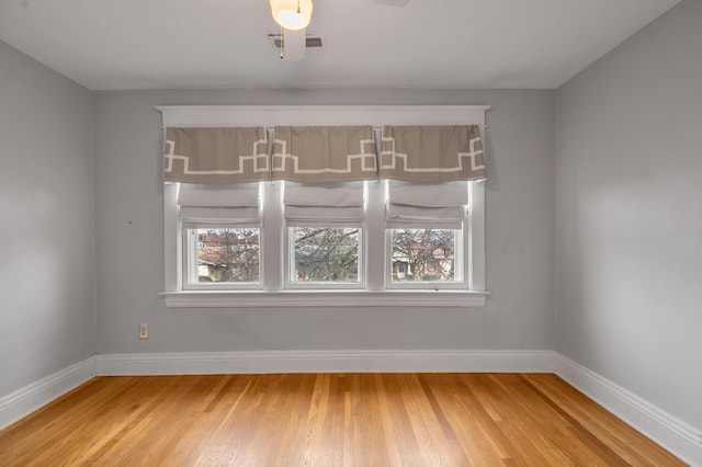 empty room featuring hardwood / wood-style flooring