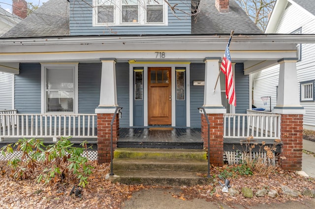 property entrance featuring covered porch