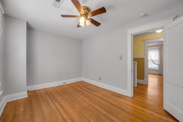 spare room featuring hardwood / wood-style flooring and ceiling fan