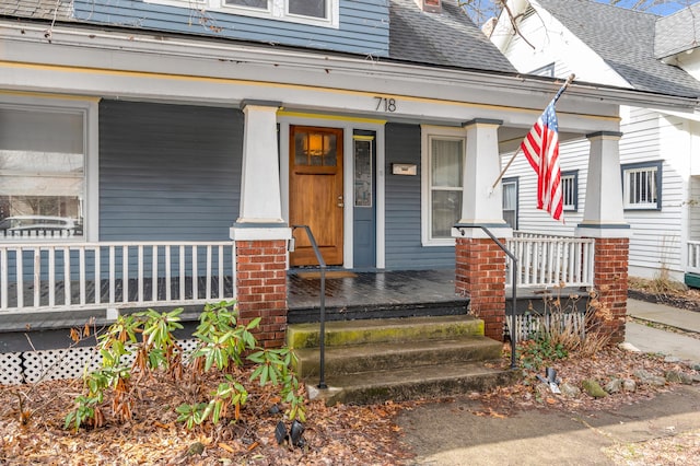 doorway to property with covered porch