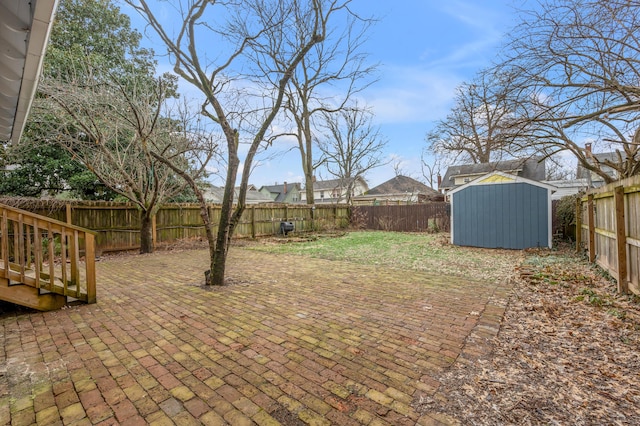 view of yard with a patio area and a shed