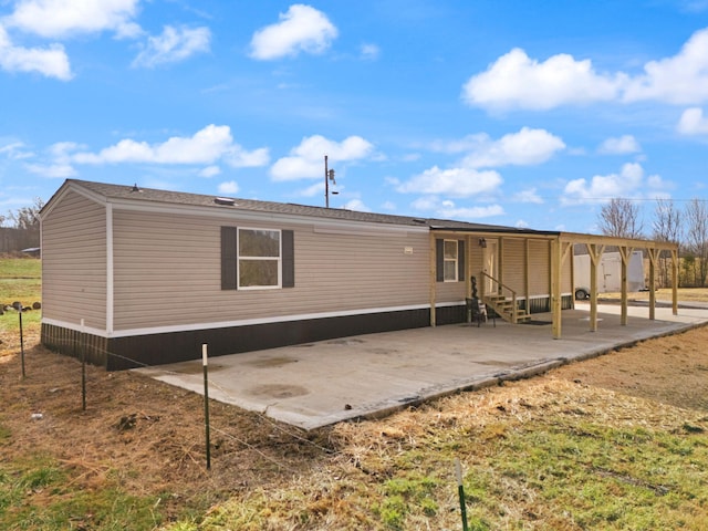 back of property with a patio area