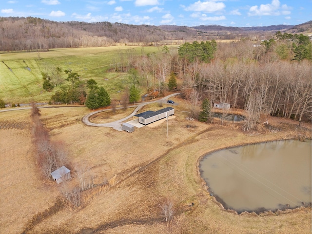 drone / aerial view featuring a water view and a rural view