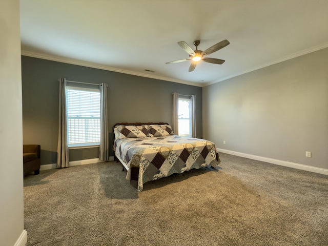 bedroom with baseboards, crown molding, and carpet