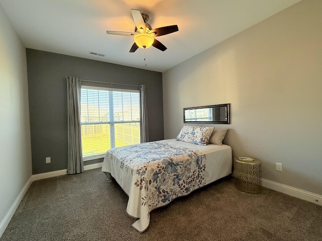 bedroom with visible vents, ceiling fan, baseboards, and dark colored carpet