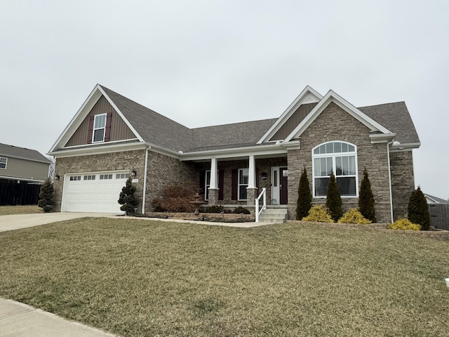 craftsman-style house featuring a garage, a front yard, and covered porch