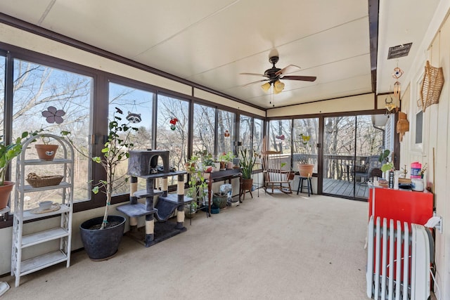 sunroom / solarium with ceiling fan