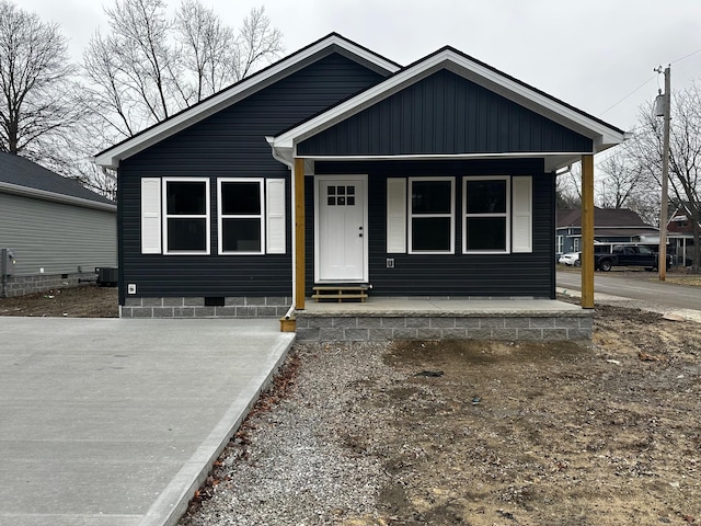 view of front of house with central AC and a porch