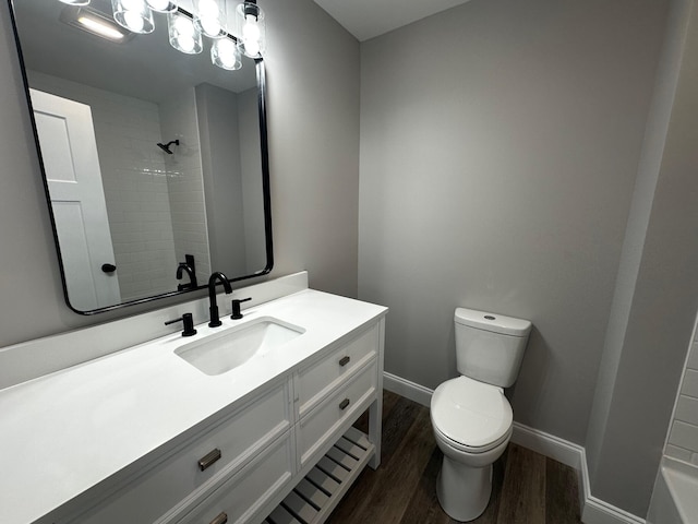 bathroom with vanity, hardwood / wood-style floors, and toilet