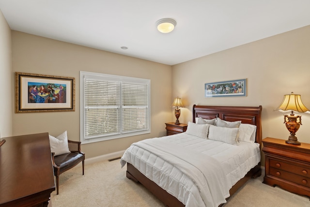 carpeted bedroom with baseboards