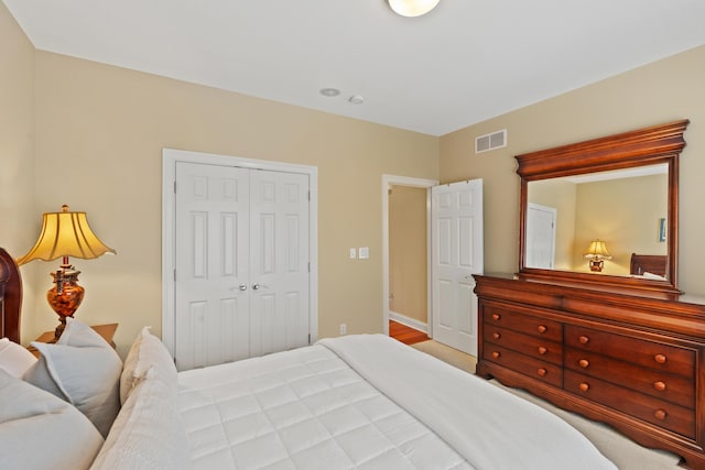 bedroom featuring a closet and visible vents