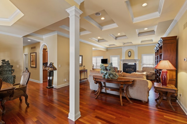 living area with decorative columns, visible vents, a large fireplace, wood finished floors, and coffered ceiling