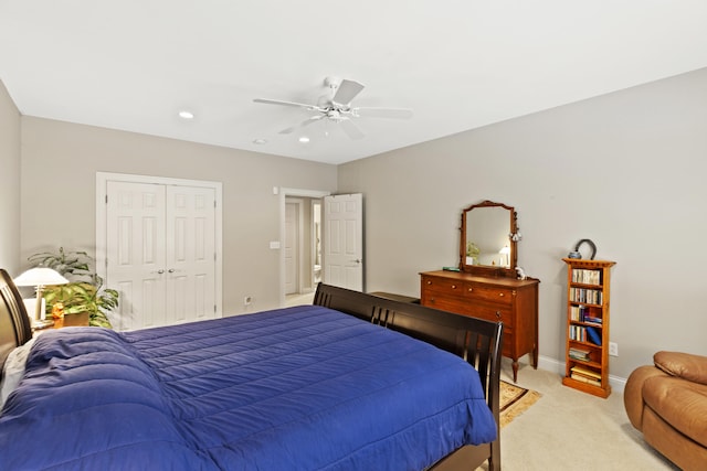 bedroom with baseboards, light colored carpet, ceiling fan, a closet, and recessed lighting